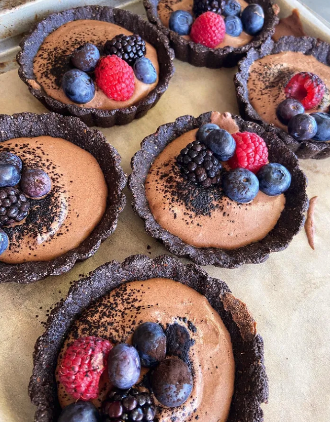 a tray of chocolate tarts